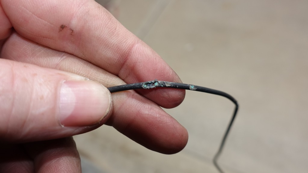 This wire was run under the truck with zero protection when it came in contact with sharp things. There were several bad spots on the wire, this one shorted to the frame, killing my bed lights.